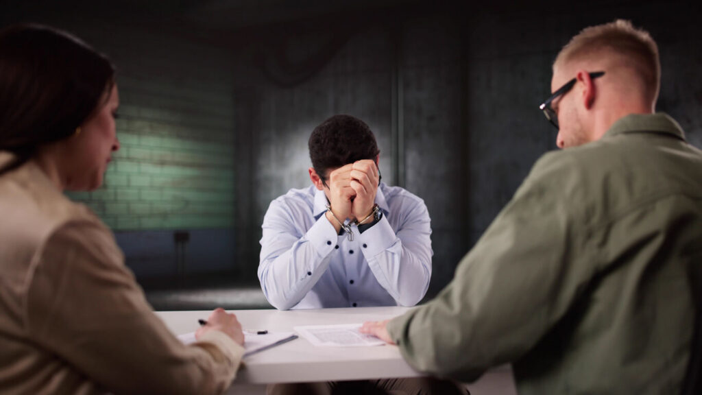 person facing theft charges consulting with defense attorney